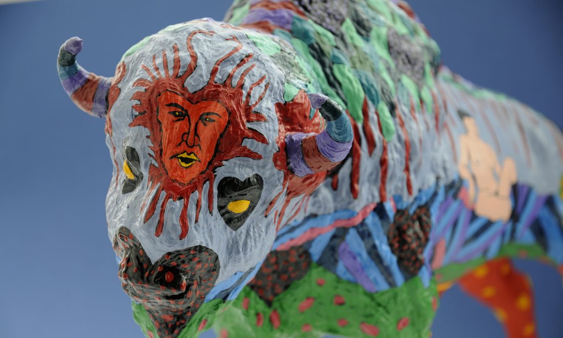 Colourfully painted plastic buffalo