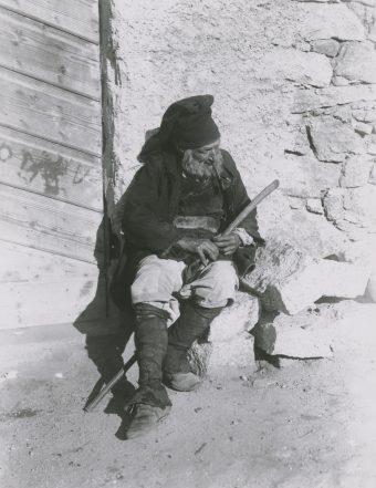 Nuoro, Sardinia, farmer, old man sitting on bricks, pipe, cane, rod, 