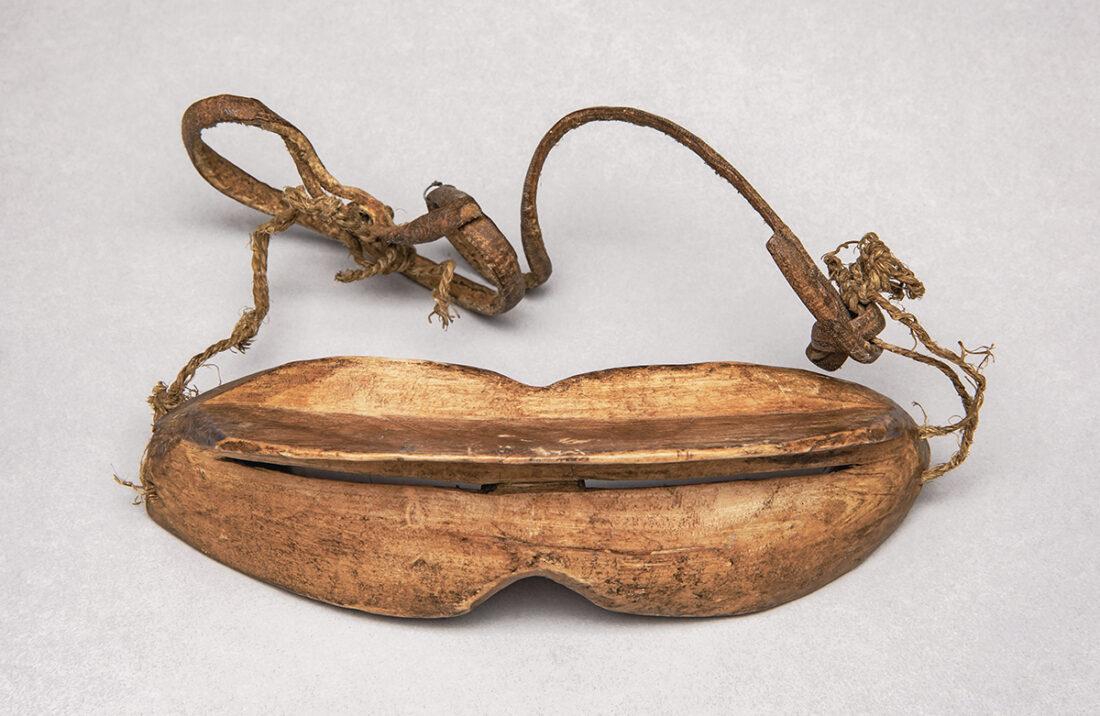 Snow goggle, Iñupiat, Alaska, late 19th – early 20th century, Wood, leather strap