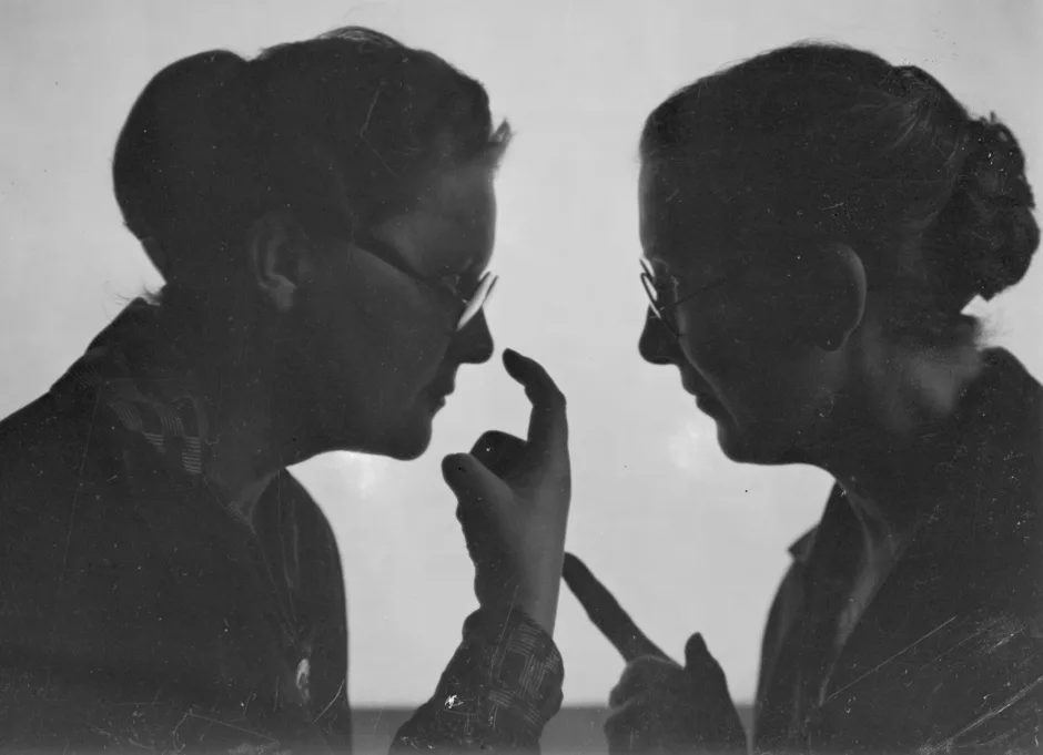 Two women, conversation, gestures, b/w photograph