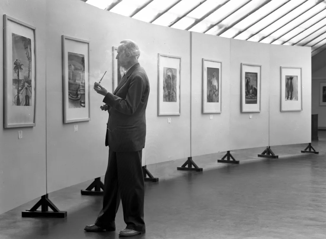 Man smoking, exhibition, paintings, b/w photograph