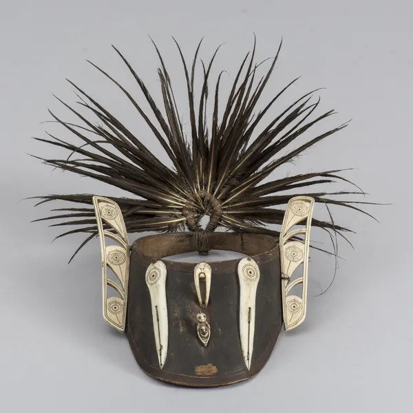 Wooden Eye Shade with Carvings from Whale Tooth
